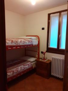 Postel nebo postele na pokoji v ubytování Casa vacanze Emilio
