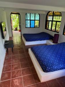 Postel nebo postele na pokoji v ubytování Jaragual EcoHostel