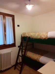 Postel nebo postele na pokoji v ubytování Casa vacanze Emilio