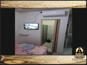 TV a/nebo společenská místnost v ubytování Pousada Piratas Di San Rocco