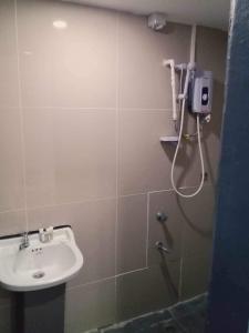 a bathroom with a sink and a shower at HomeStay Private Home in Suva