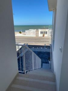 a view of the ocean from the stairs of a building at Appartamenti Dreams in Marotta +2 photos