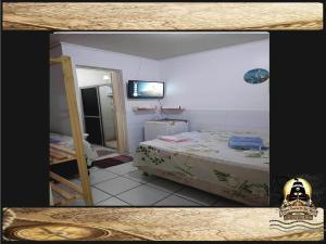 Postel nebo postele na pokoji v ubytování Pousada Piratas Di San Rocco