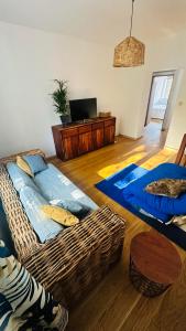 a living room with a couch and a table at M&M Apartment Warsaw in Warsaw