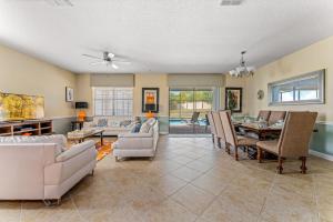 a living room filled with furniture and a table at Modern 8-Bed Champions Gate Disney Magic Awaits in Davenport