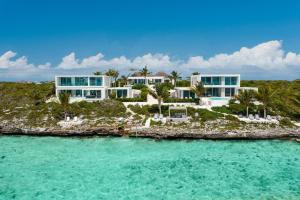 an aerial view of a house on an island at Ocean Dream 5 BR Villa Azur in Long Bay Hills