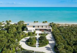 an aerial view of a house on the beach at Clevelander in Long Bay Hills