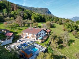 an aerial view of a house with a pool at La Flémingîte in Scionzier