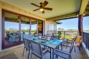 a dining room with a table and chairs on a balcony at KaMilo at Mauna Lani Condo with Resort Pool Access! in Waikoloa