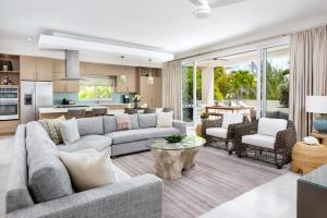 a living room with a couch and a table at Second Wind Villa in Long Bay Hills