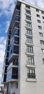 a tall building with many windows on the side of it at Apartment with nice view in Beylikduzu
