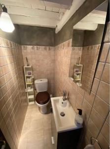 a bathroom with a toilet and a sink at Casa Paci 