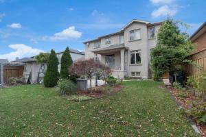 a large house with a yard at Luxury 4BR - Pool Table - 10 min to Yorkdale Mall in Toronto
