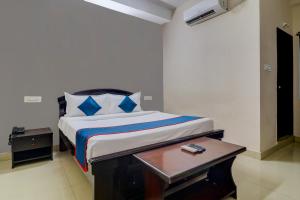 Säng eller sängar i ett rum på Atlas Stays at DLF Gachibowli