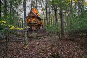 a tree house in the middle of the woods at Enchanted Evergreen in Coffeyville