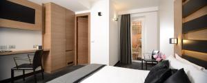 Postel nebo postele na pokoji v ubytování Hotel Trevi - Gruppo Trevi Hotels