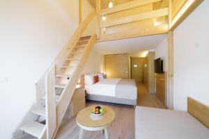 Rúm í herbergi á Gstaaderhof - Active & Relax Hotel