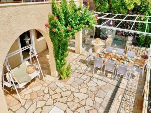 an overhead view of a patio with a table and chairs at Villa Tesoro Kalami with private pool by DadoVillas in Kalami