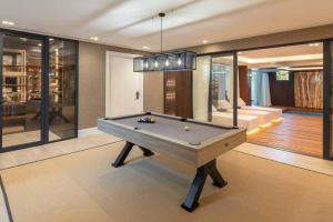 a room with a pool table in a house at Villa Mercedes - Luxury 5-Bedroom Villa in Las Brisas, Marbella in Marbella