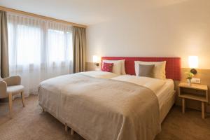 Rúm í herbergi á Gstaaderhof - Active & Relax Hotel