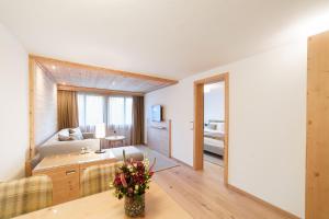Rúm í herbergi á Gstaaderhof - Active & Relax Hotel