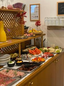 a buffet line with many different types of food at Pension Rucksackpeter in Hohenbrugg an der Raab