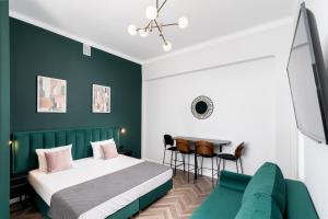 Łóżko lub łóżka w pokoju w obiekcie Wawel Boutique Residence - Krakow Old Town