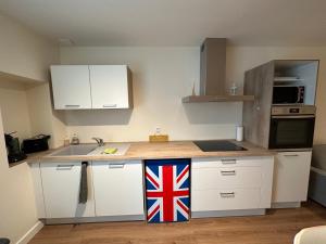 a kitchen with a british flag on the counter at T2 hyper centre LONS LE SAUNIER in Lons-le-Saunier
