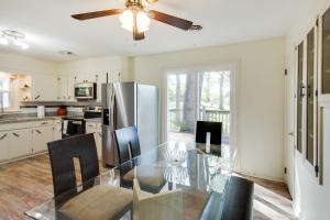 a kitchen with a glass table and a stainless steel refrigerator at Harrisonburg Family Home with Deck, 4 Mi to Downtown in Harrisonburg