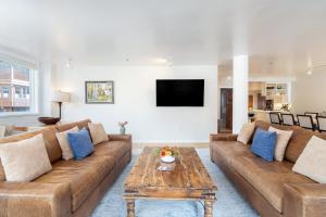 a living room with a couch and a table at Ice House 317 condo in Telluride