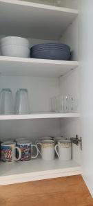 Kuchyňa alebo kuchynka v ubytovaní Mieszkanie, apartament z przepięknym widokiem, blisko starówki, plaży
