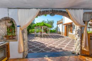 an entrance to a house with an archway at Villa Simba in Massa Lubrense