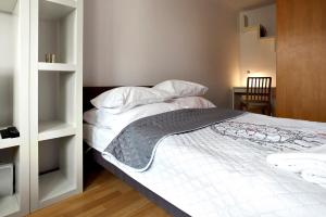 Posteľ alebo postele v izbe v ubytovaní P&O Apartments Bielany