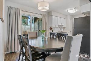 a kitchen and dining room with a table and chairs at Walk to Barton Springs Spacious Apt Backyard in Austin