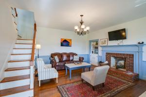 a living room with a couch and a fireplace at Historic Raphine Retreat Near Brownsburg Village! in Raphine