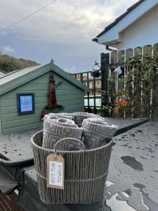a basket with a tag on it sitting on a table at Sixty Four - with 2 free car parking spaces in The Mumbles
