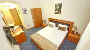 Voodi või voodid majutusasutuse Port Hotel Baku toas