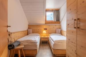 Postel nebo postele na pokoji v ubytování Residence Prapoz
