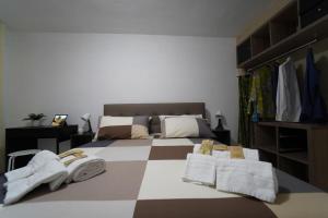 a bedroom with a bed with towels on it at Casa Consiglia in Corbara +29 photos