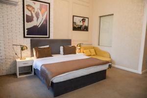 a bedroom with a large bed in a room at Zimmer Boutique Hotel in Baku