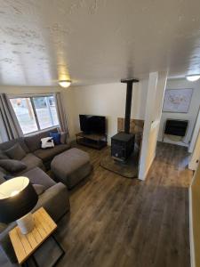 a living room with a couch and a fireplace at The Gold Mine Cottage in Idaho City