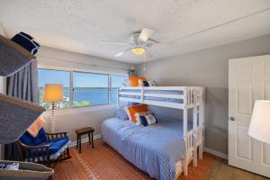 a bedroom with a bunk bed with a view of the ocean at Pinnacle Port 304A in Panama City