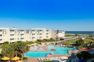 a resort with a swimming pool next to the ocean at A Place at the Beach 348 in Atlantic Beach