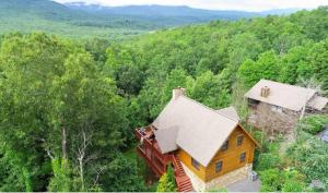 an overhead view of a house in the woods at LUX 4BD Lodge w/ Views! Fire Pits + HOT TUB + Pool in Gatlinburg