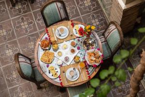 an overhead view of a table with breakfast foods on it at Riad Arabesque in Marrakesh