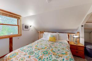 a bedroom with a bed and a window at Running Fox Farm in Baraboo