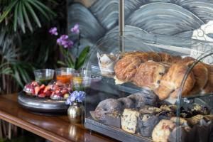 a display case filled with different types of pastries at The Dominick Hotel in New York