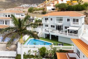 an aerial view of a house with a swimming pool at Villa Exotica in Adeje