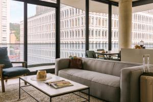 a living room with a couch and a table at Sonder Maisonneuve in Montréal