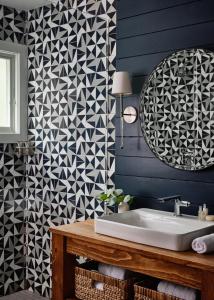 a bathroom with blue walls and a white sink at Journey East Hampton in East Hampton